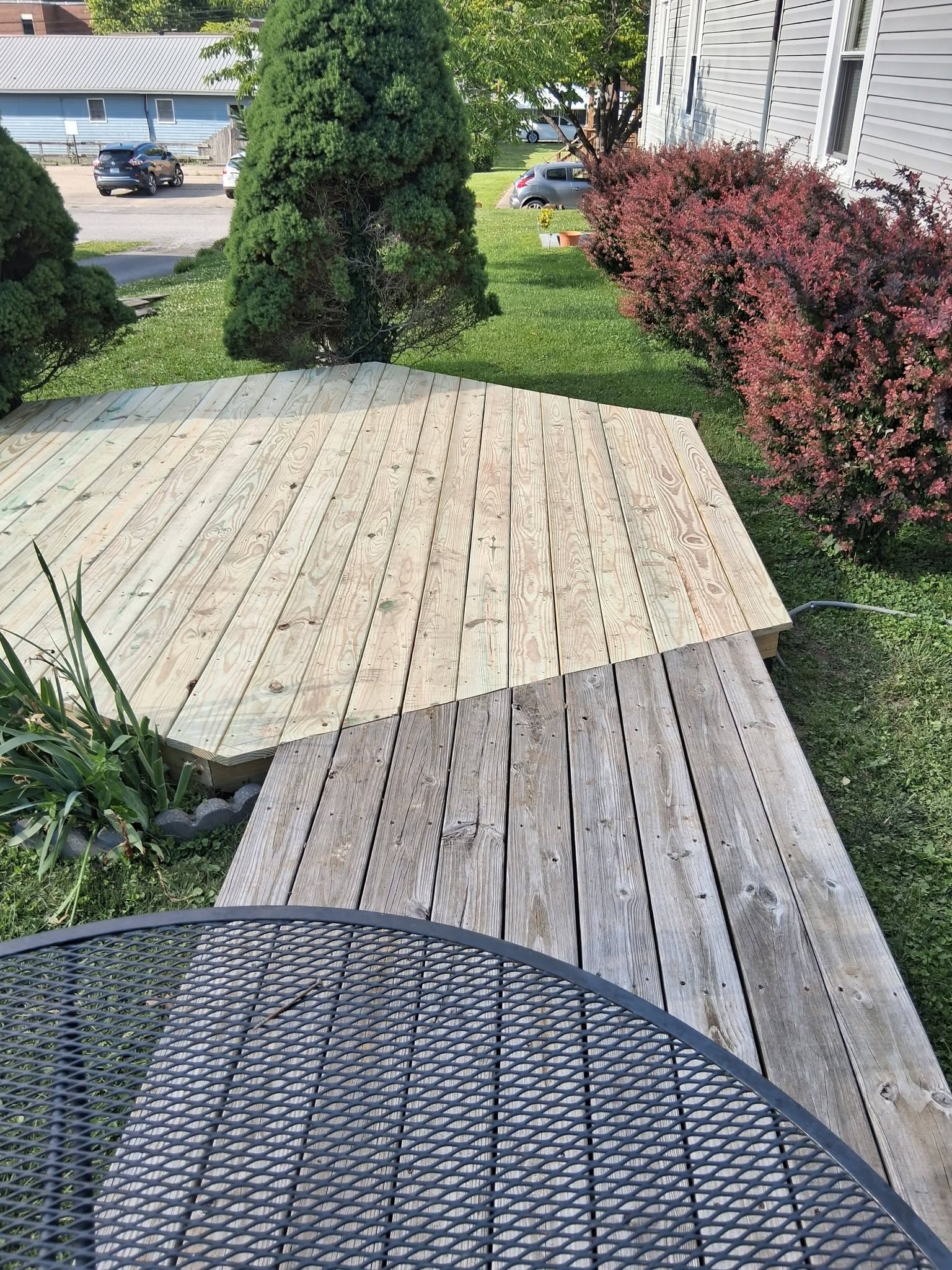 Newly built pressure-treated deck beside a home in Harlan, KY